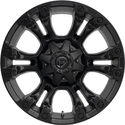 Black alloy wheel rim with a star-shaped spoke design and a central hub cap bearing a logo.